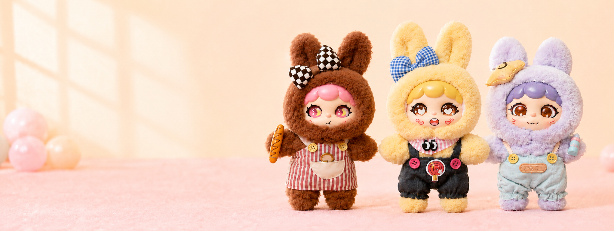 Three SugarBuns MonsterPals on a soft pastel background